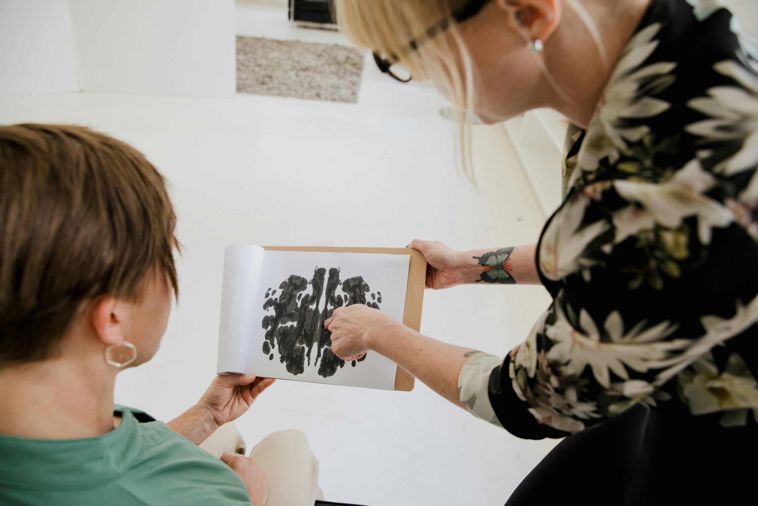 A psychologist conducting neuropsychological evaluation on a patient