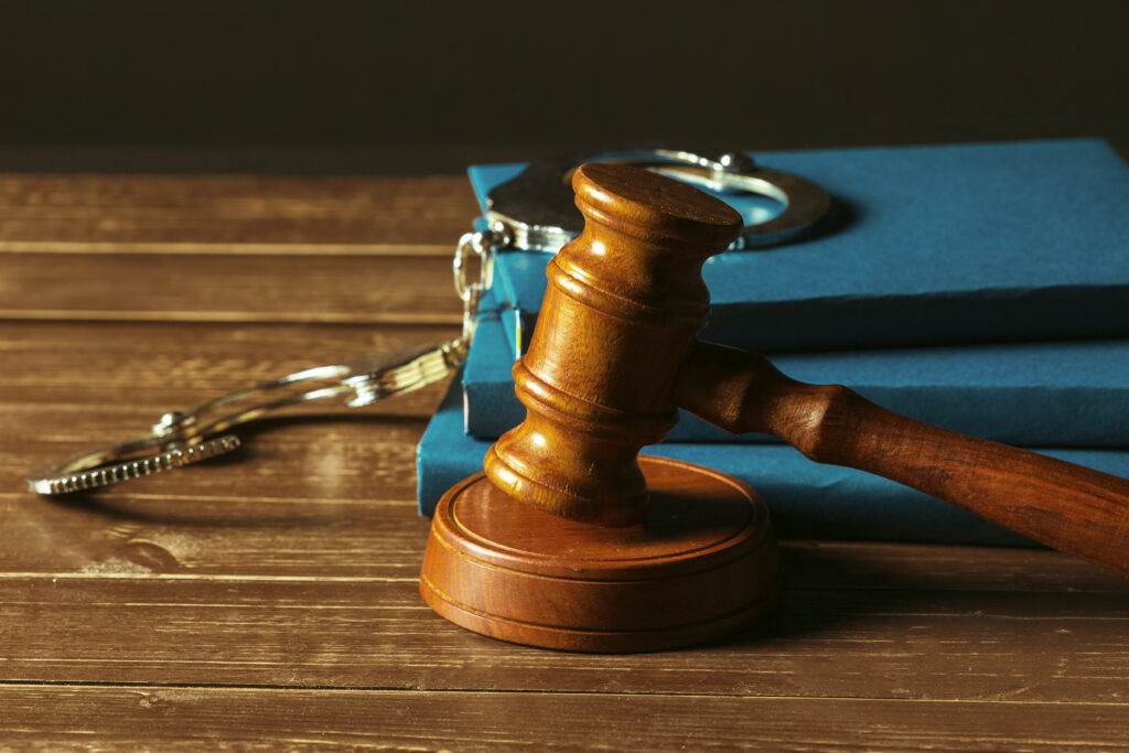 Image of a gavel with handcuffs