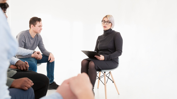 A psychologist explaining to his patients