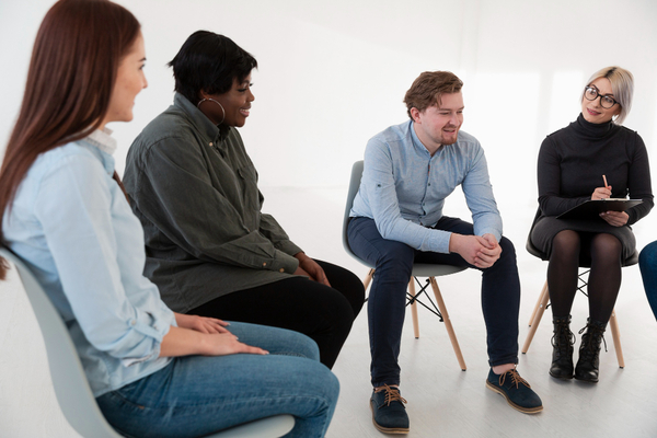 Group of people listening to a psychologist