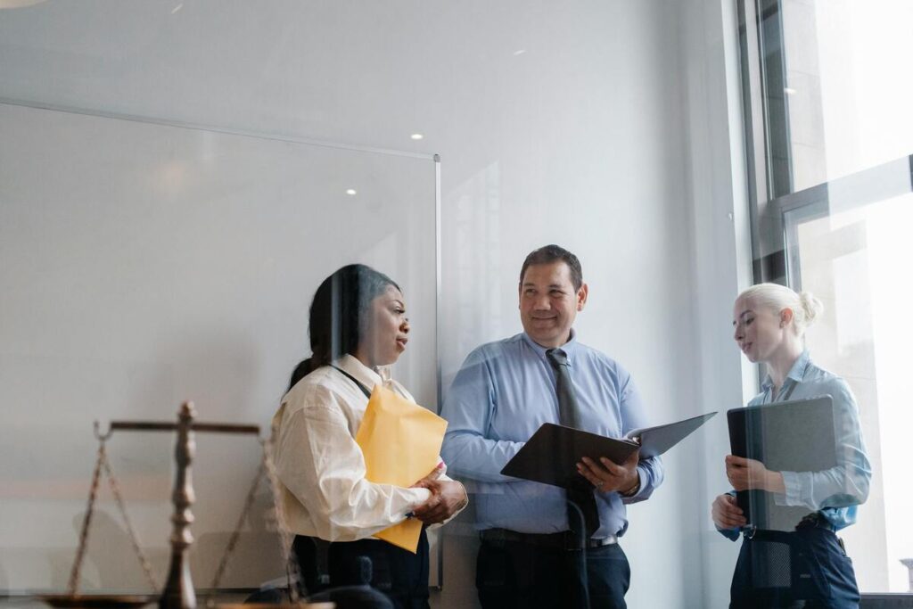 Three forensic psychologist discussing legal matters with each other