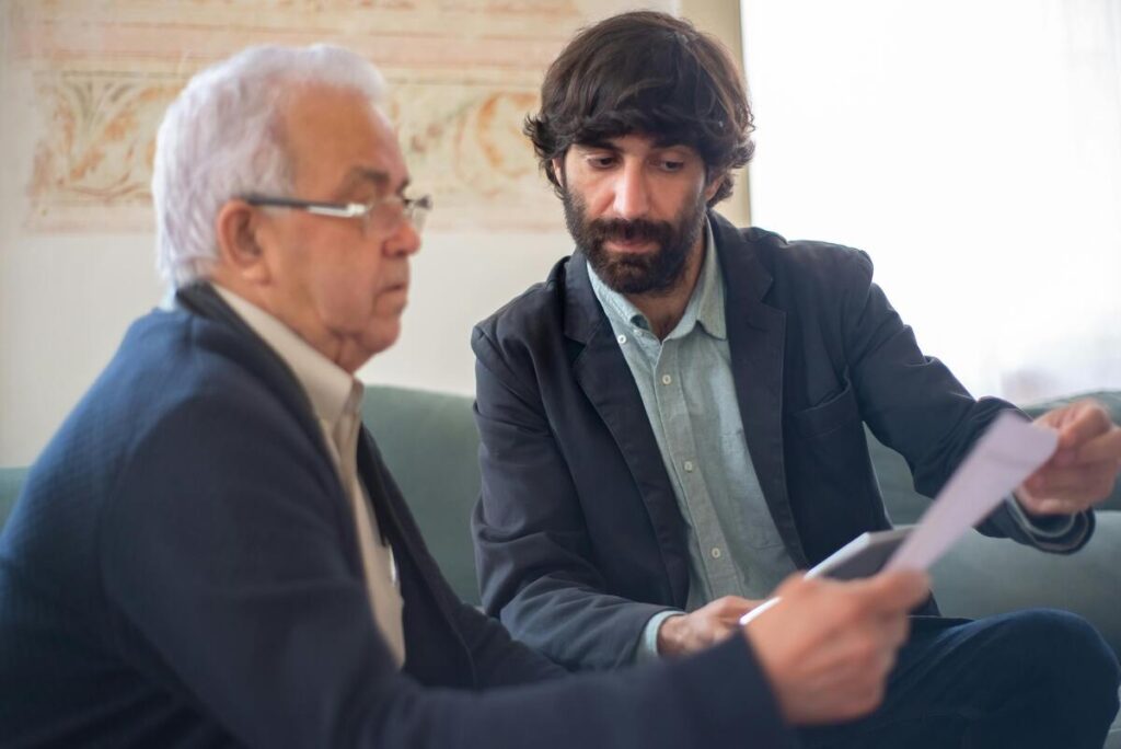 An insurance agent explaining a document to a client