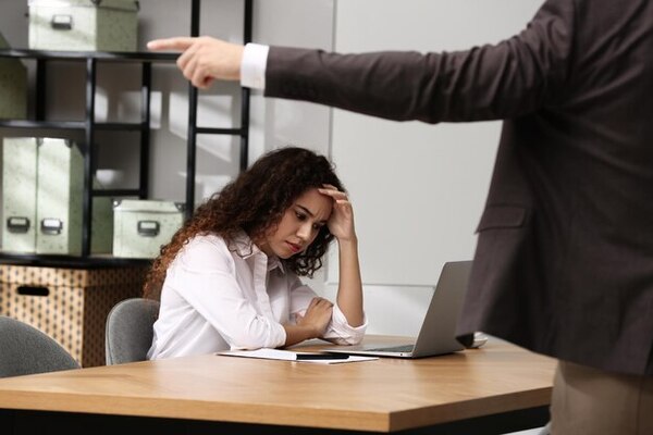 A lady experiencing workplace harassment