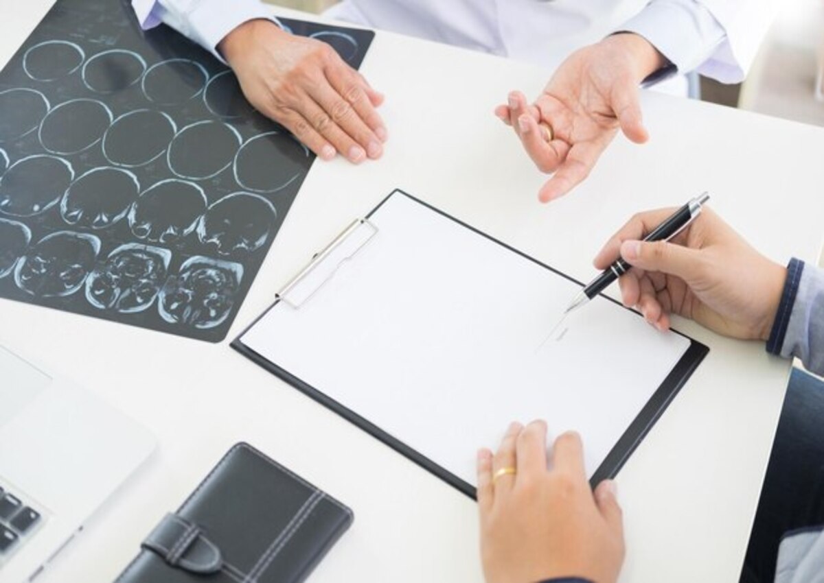 A neuropsychologist reviewing a patient's MRI results