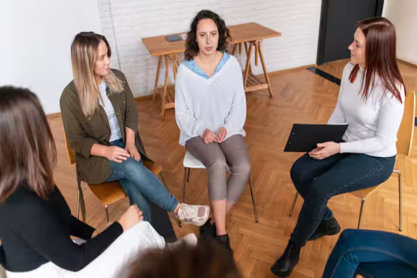 A therapist conducting a group trauma therapy session