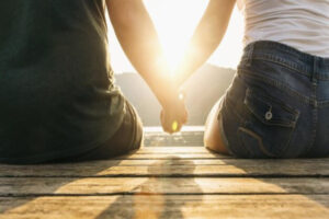 Couples holding hands together restoring emotional safety and confidence with each other