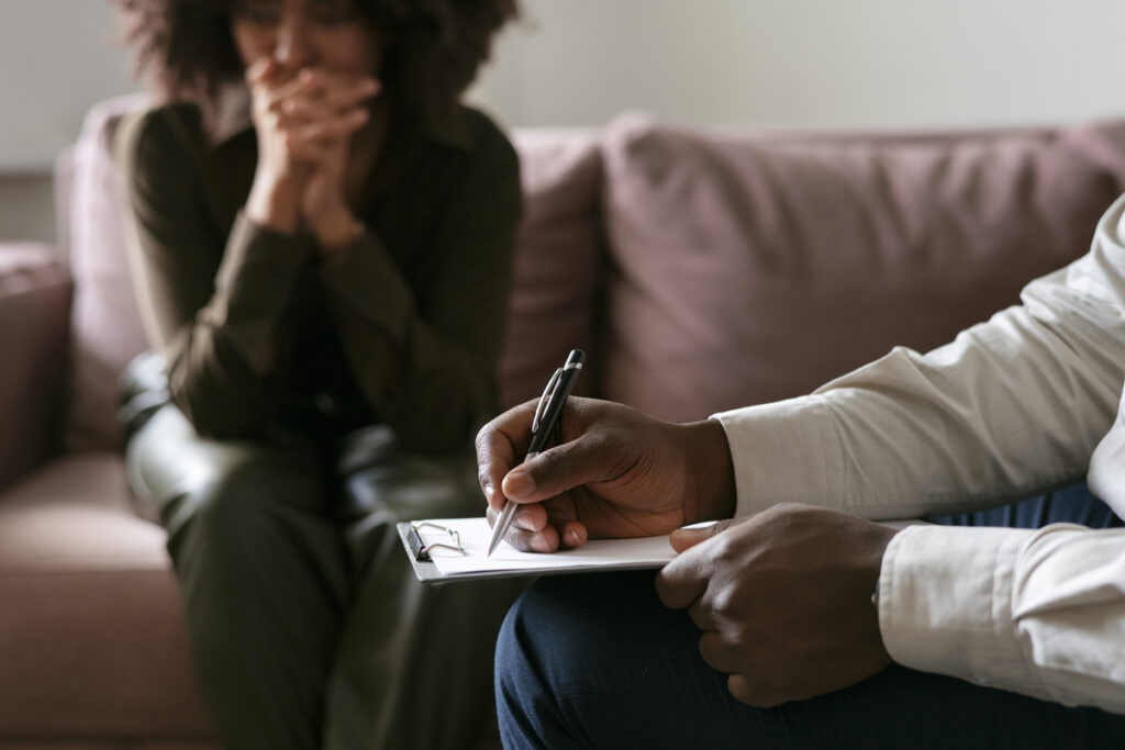 A psychologist assessing a patient through neuropsychological evaluation