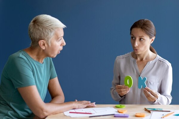 A medical professional conducting a neuropsychological evaluation to identify issues in communication